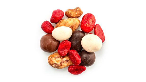 Sugar peanuts [blanched peanuts, sugars (icing sugar, glucose syrup, cane sugar), vegetable oil, soy lecithin, shellac, allura red (FD&C Red No. 40)] , Almonds (non-GMO-canola oil, salt), Yogurt peanuts [yogurt (sugar, palm kernel oil, yogurt powder, milk, soy lecithin, natural flavor, salt), dry roasted peanuts, shellac], Milk chocolate peanuts [sugar, cocoa butter, unsweetened chocolate, whole milk powder, non-fat milk powder, soy lecithin, vanilla extract, peanuts, glazing agent (coconut), polishing agent], Chocolate raisins [unsweetened chocolate, sugar, cocoa butter, soy lecithin (emulsifier), vanilla extract, sultana raisins, vegetable oil, glazing agent (coconut), polishing agent],  Cashews (cashews, non-GMO-canola oil, salt)