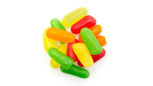 Sugars (sugar, corn syrup), Modified corn starch, Fumaric acid, Sodium citrate, Natural and artificial flavours, Corn dextrin, Citric acid, Malic acid, Shellac, Carnauba wax, Modified coconut and/or palm kernel oil (medium chain triglycerides), Allura red, Sunset yellow FCF, Tartrazine, Brilliant blue FCF.