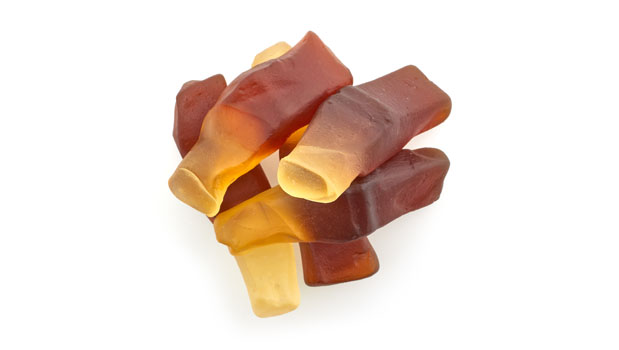 Sugars [glucose syrup, sugar], Gelatin, Modified potato starch, Citric acid, Lactic acid, Coating agents (palm oil, beeswax, carnauba wax), Ammonia caramel (color), Artificial flavor.