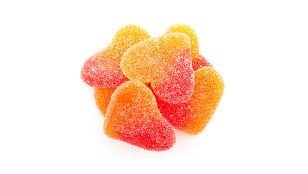 Sugars (glucose syrup, sugar), Gelatin, Modified potato starch, Lactic acid, Citric acid, Artificial flavor, Colors [allura Red (FD&C Red No. 40), curcumin, anthocyanin, carotene]