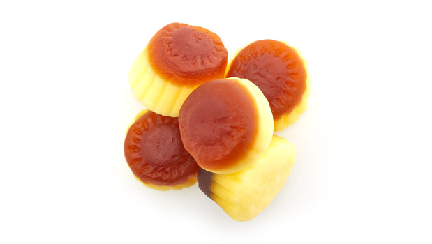 Sugars (glucose syrup, sugar), Gelatine, Modified potato starch, Lactic acid, Coating agents (palm oil, beeswax, carnauba wax), Artificial flavor, Colors (caramel, turmeric)