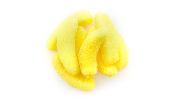 Sugars (glucose syrup, sugar), Gelatin, Modified potato starch, Citric acid, Lactic acid, Artificial flavor, Turmeric.